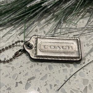 Coach Metallic Silver Keychain 2”x1”